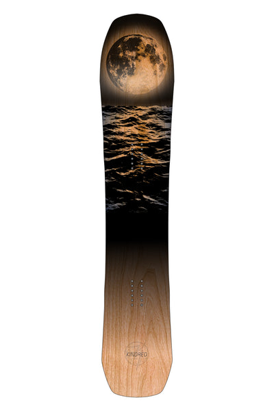 Kindred Ukee Snowboard with a moonlit sea design on a white background. Snowboard shape is aggressive all mountain directional shape.